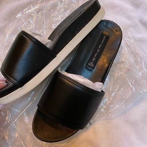 Steven black leather flatforms
